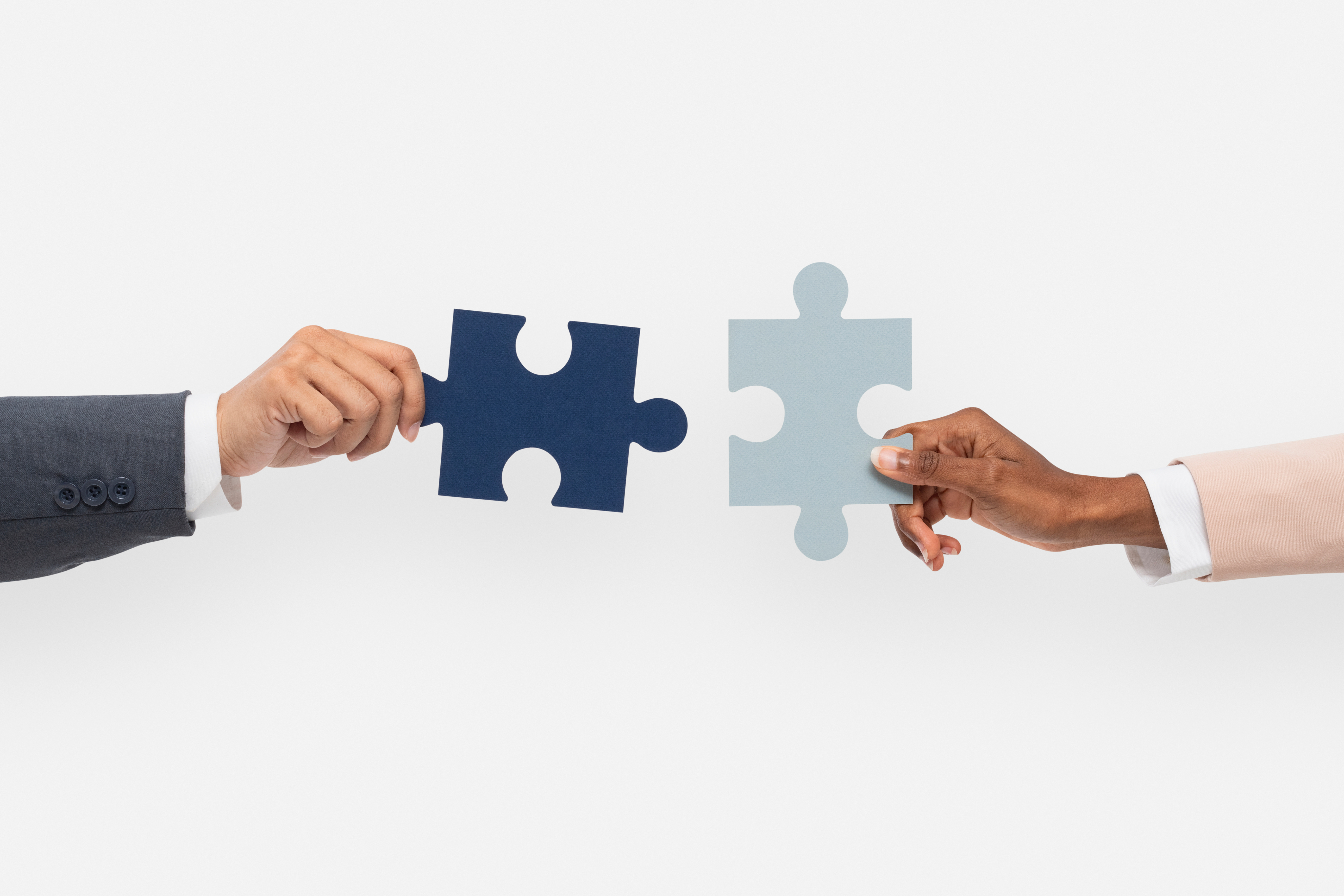 Puzzle pieces coming together representing collaboration